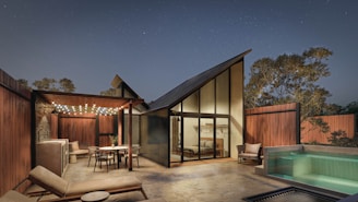 a house with a pool and a hot tub