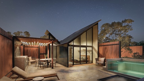 a house with a pool and a hot tub