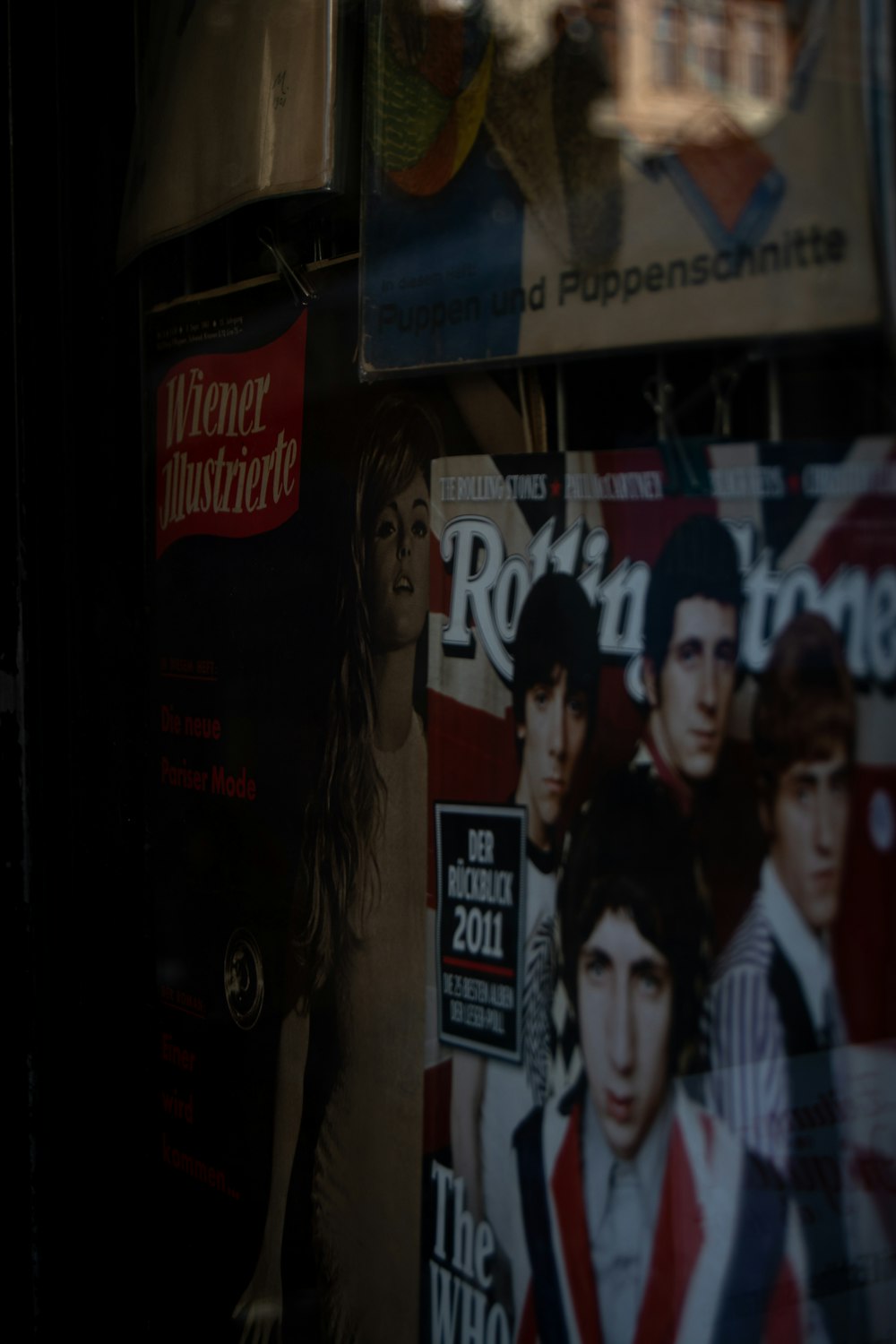 a magazine rack with magazines and magazines on it