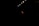 A single performer stands in dramatic lighting, surrounded by darkness. Overhead, several bright stage lights cast a focused beam onto the person, emphasizing their presence. The performer is wearing a red outfit and gesturing with an outstretched arm.
