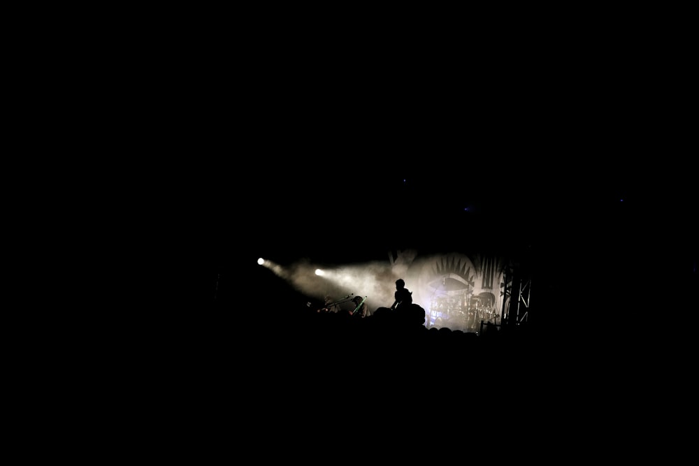 a group of people standing on top of a stage