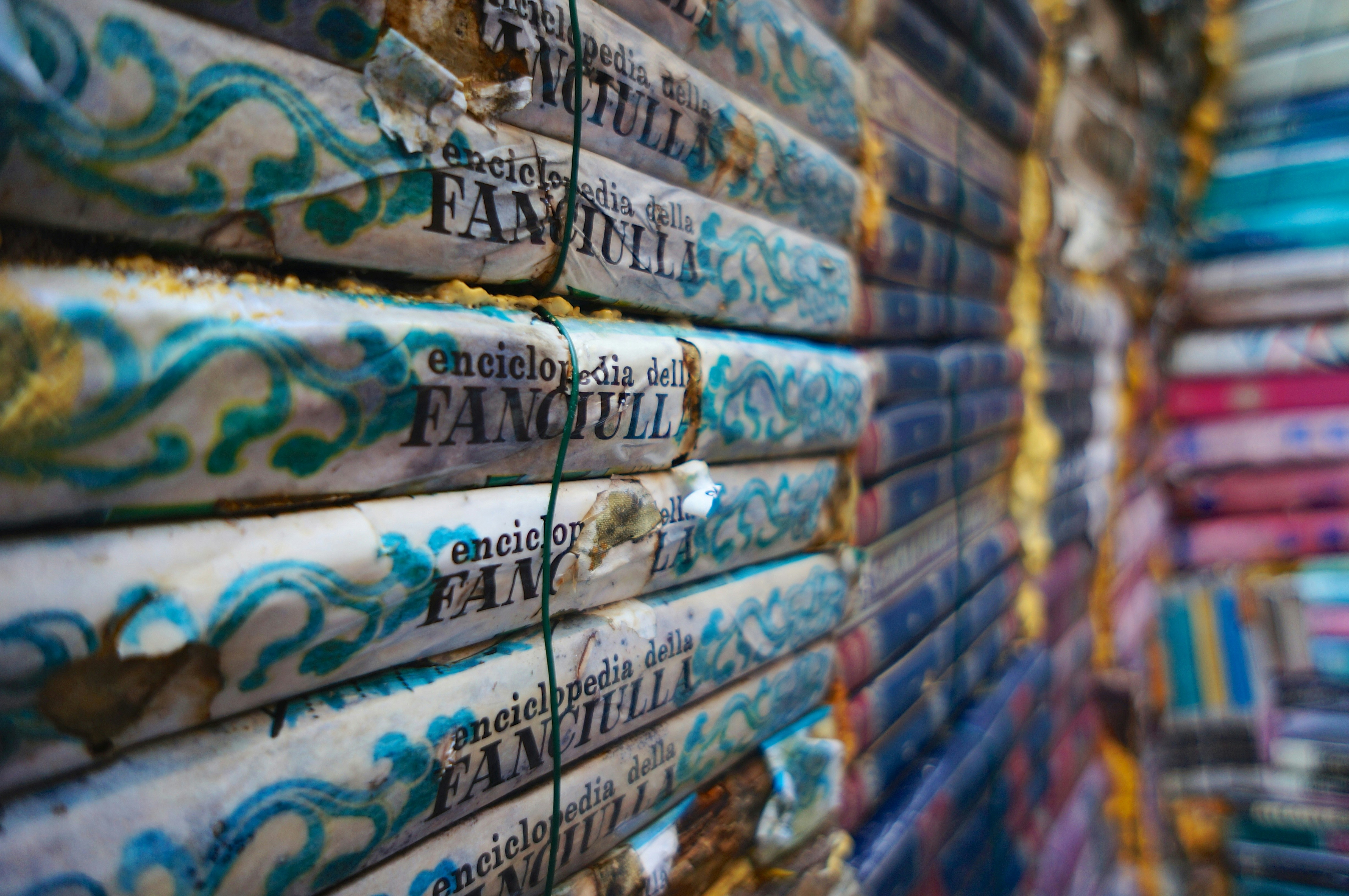 A stack of various pan masala sachets with plastic layers visible, contrasting with an image of eco-friendly packaging materials like paper pouches or biodegradable film.