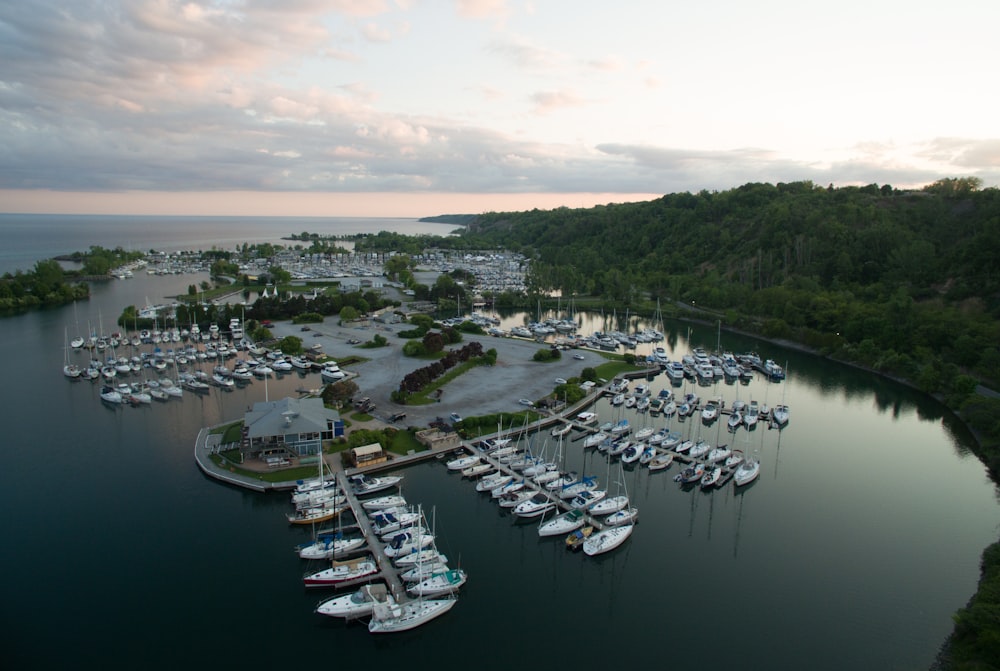 a harbor filled with lots of boats under a cloudy sky