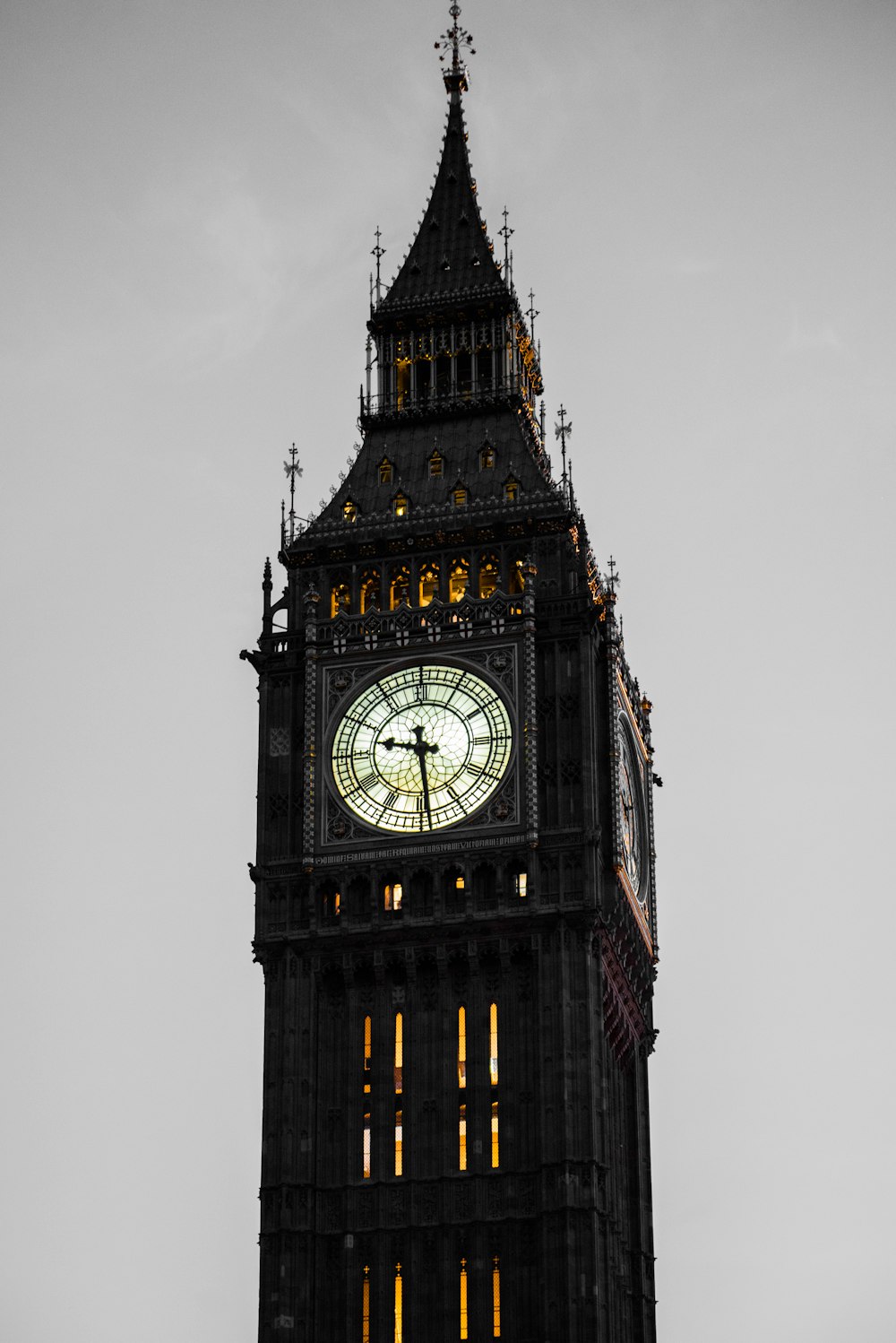 a tall clock tower with a clock on each of it's sides