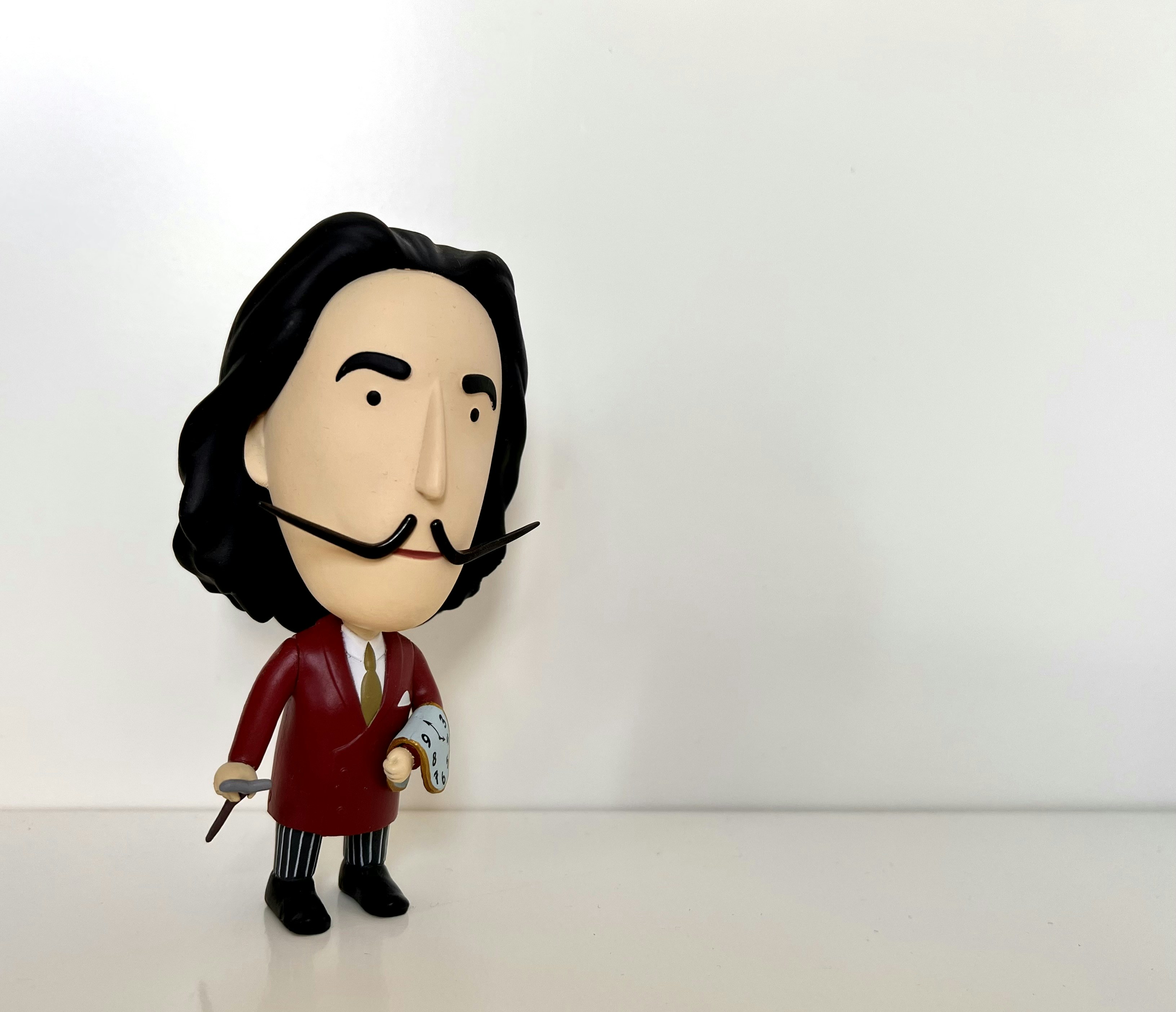 a plastic figurine of a man with a moustache