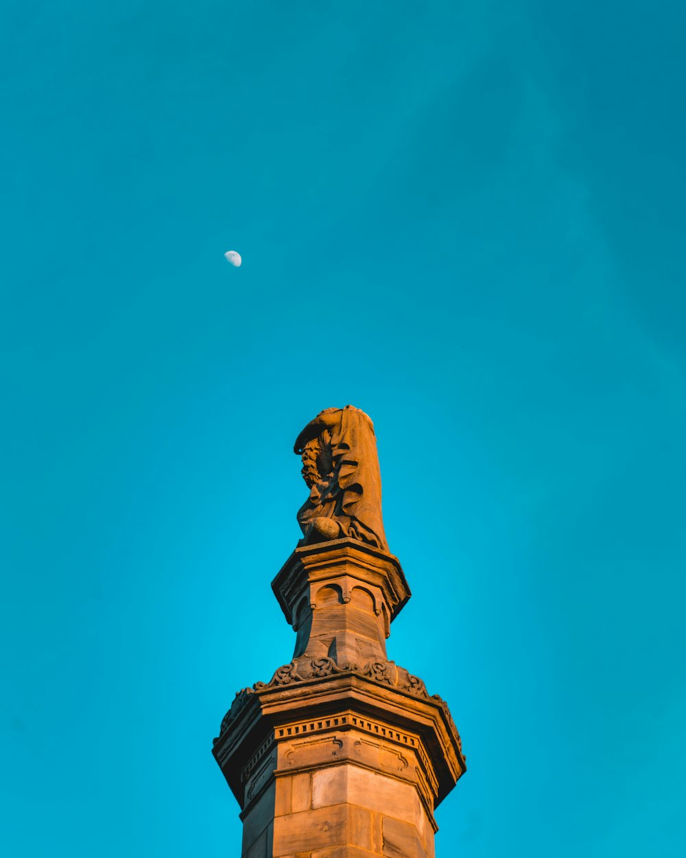 a statue of a lion on top of a building