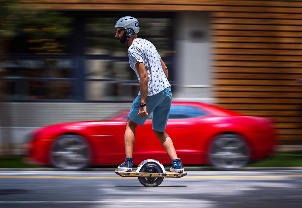 a man riding a skateboard down a street