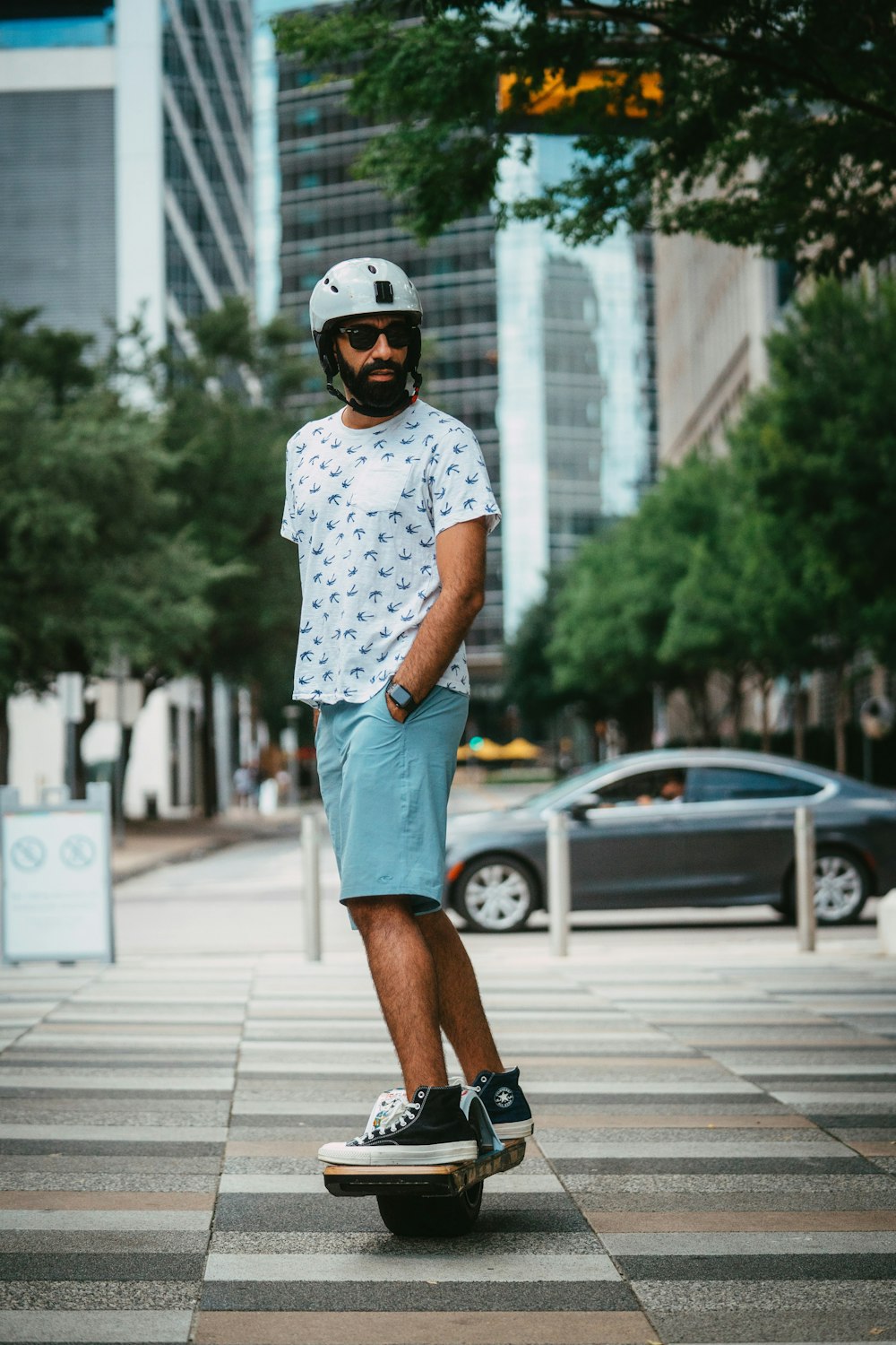 a man riding a skateboard across a street