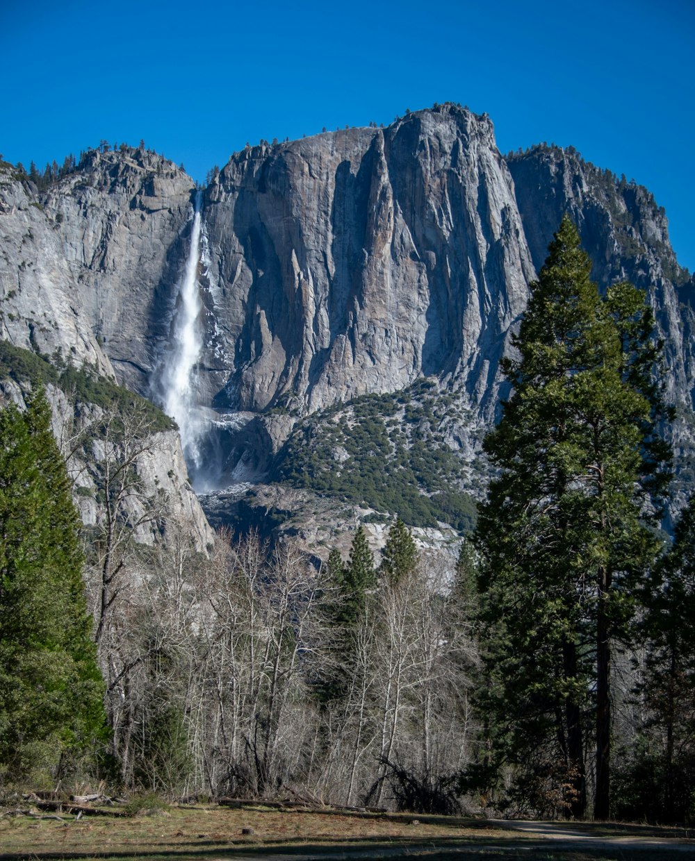 a mountain with a waterfall coming out of it