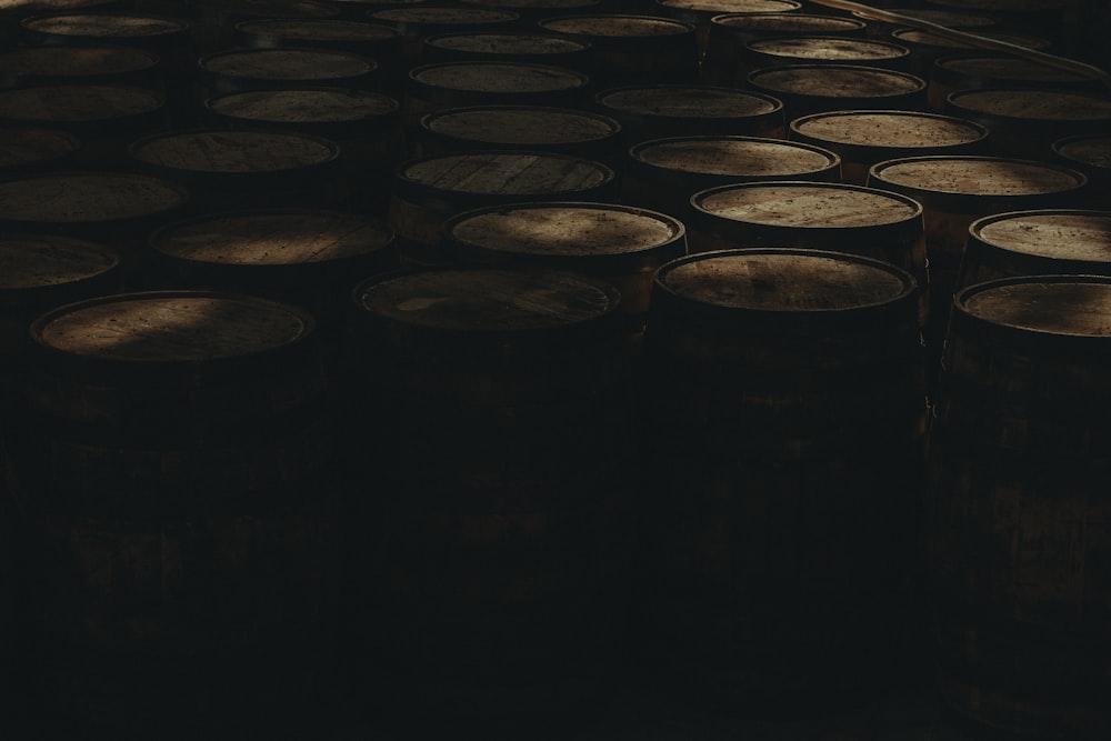 a bunch of barrels that are sitting in the dark