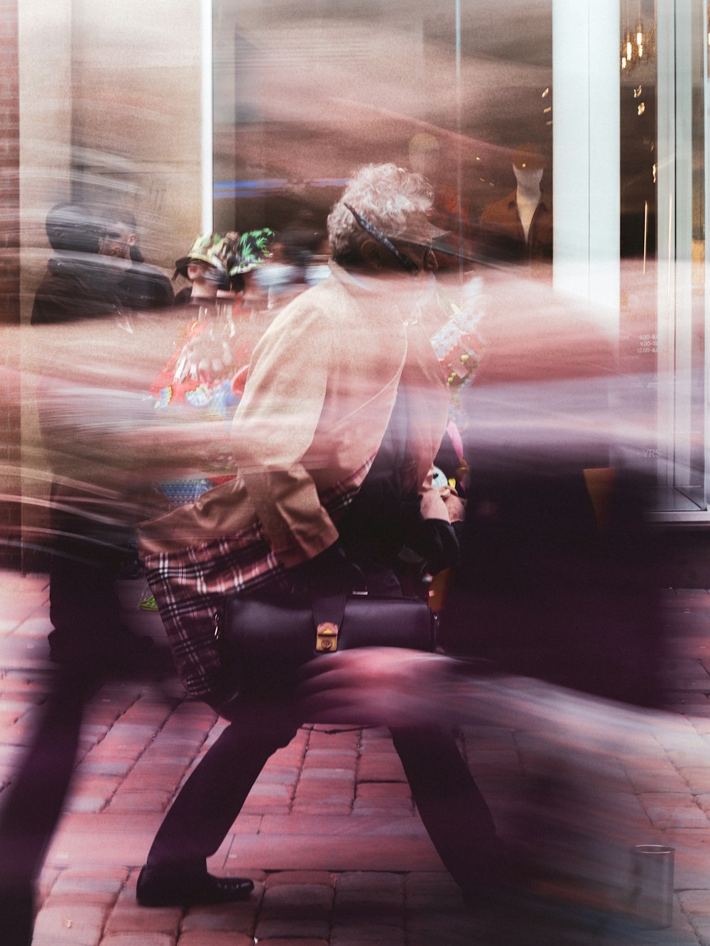 a blurry photo of a man walking down a street