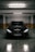 a black car parked in a parking garage