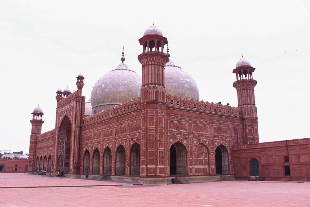 a large red brick building with a white dome