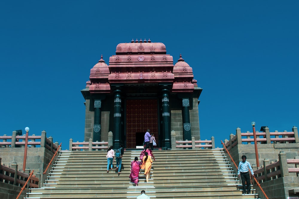 a group of people walking up a set of stairs