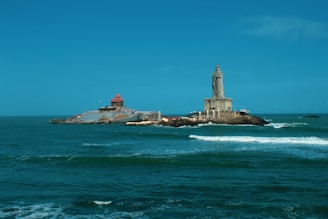 a lighthouse in the middle of the ocean
