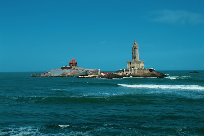 a lighthouse in the middle of the ocean