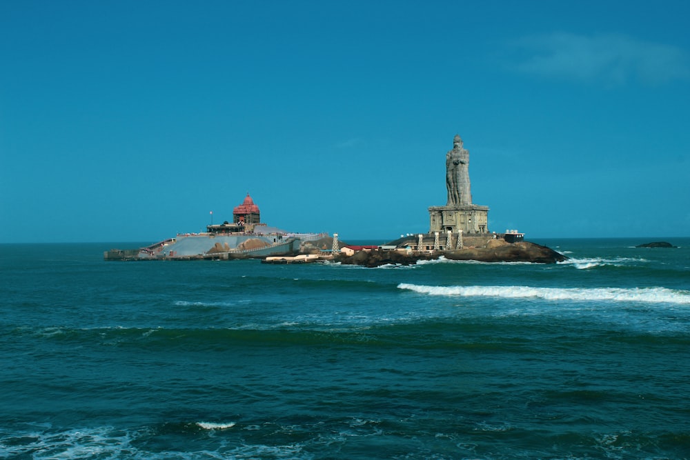 a lighthouse in the middle of the ocean