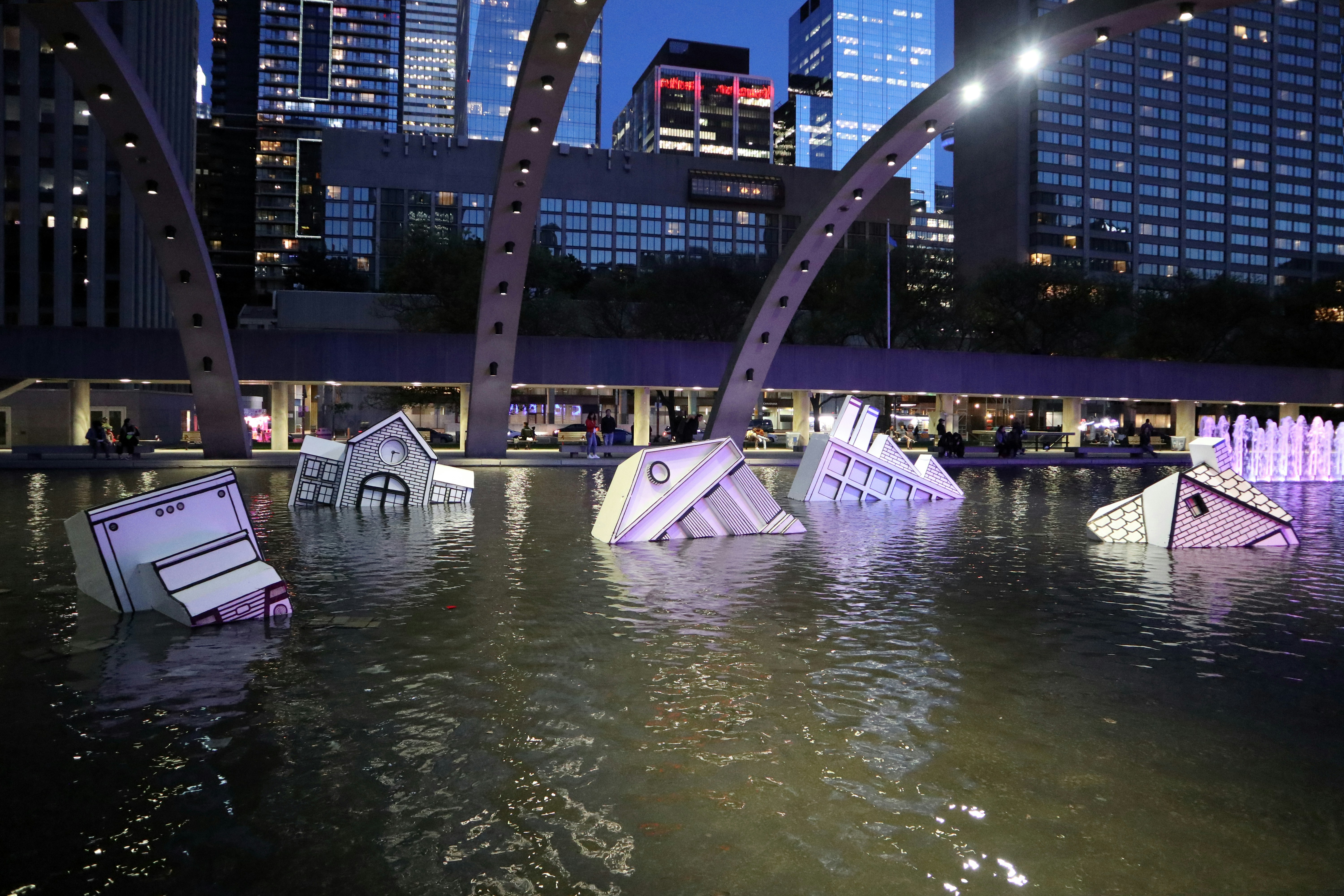 Taking the city by surprise, a two-in-one art installation has drifted into Nathan Philips Square this week. Half icebergs, half remnants of civilization, these resin sculptures are meant to represent the negative ramifications of the melting polar ice caps.