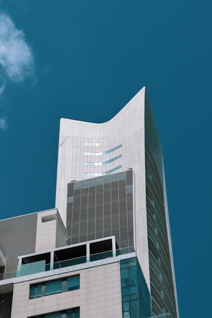 a very tall building with a sky background