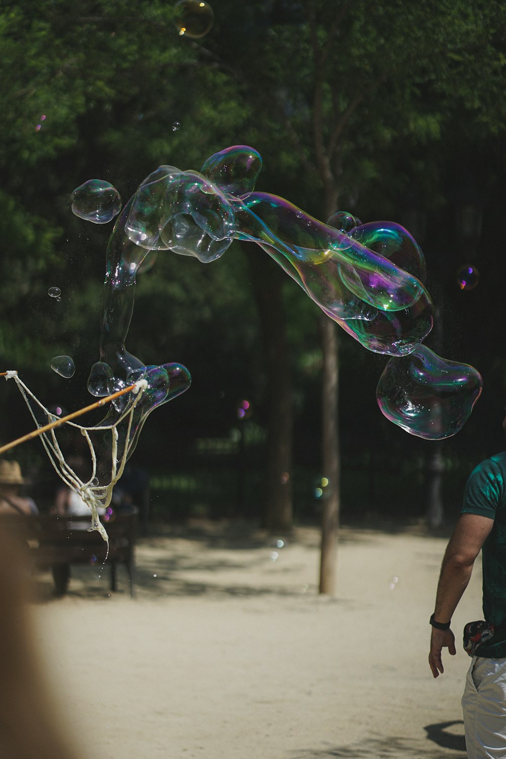 a man is blowing soap bubbles in the air