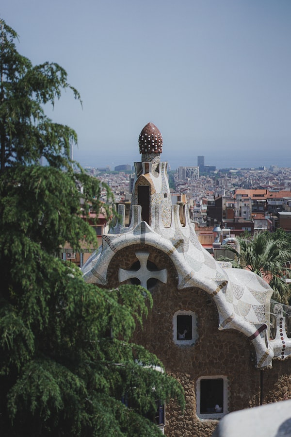 Panoramic rooftop view of Barcelona cityscape with historic buildings stretching to the horizon