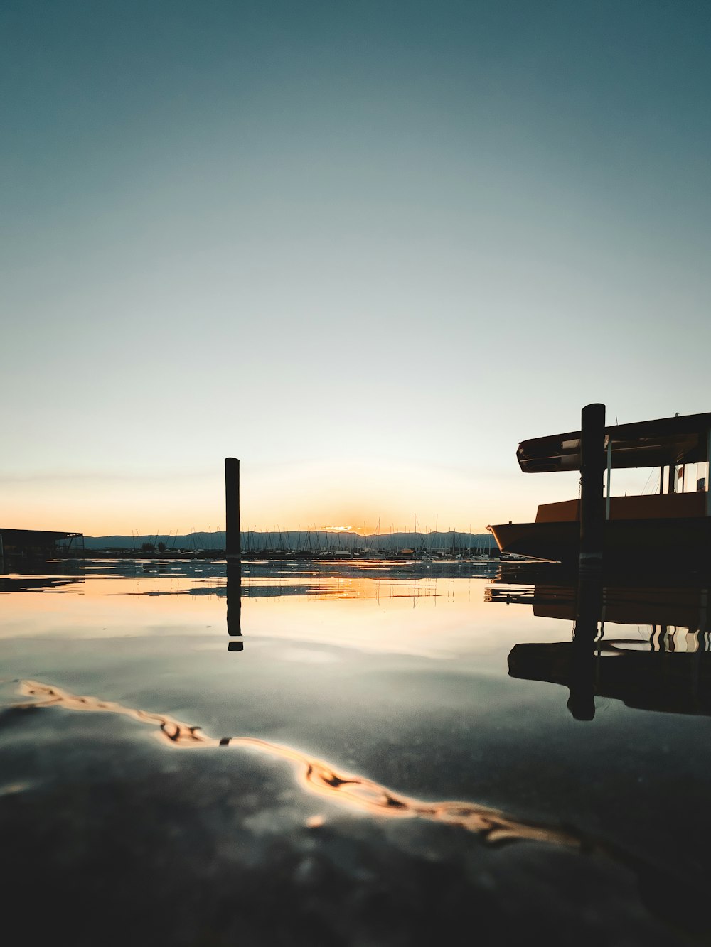 a boat sitting on top of a body of water