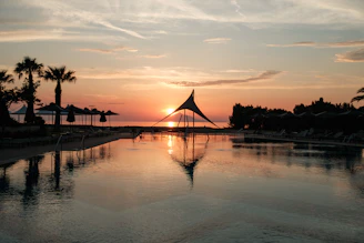 Sunset view over the peaceful pools at the pousada with vibrant orange sky