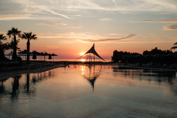 Sunset view over the peaceful pools at the pousada with vibrant orange sky