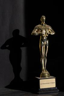 a statue of a person holding a trophy