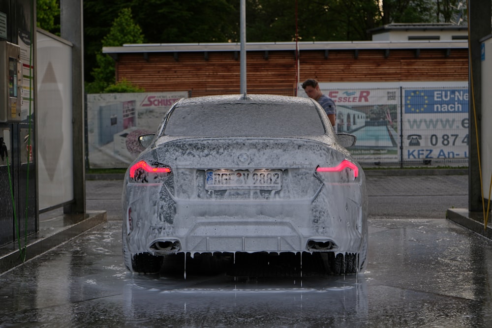 a car is covered in ice and water