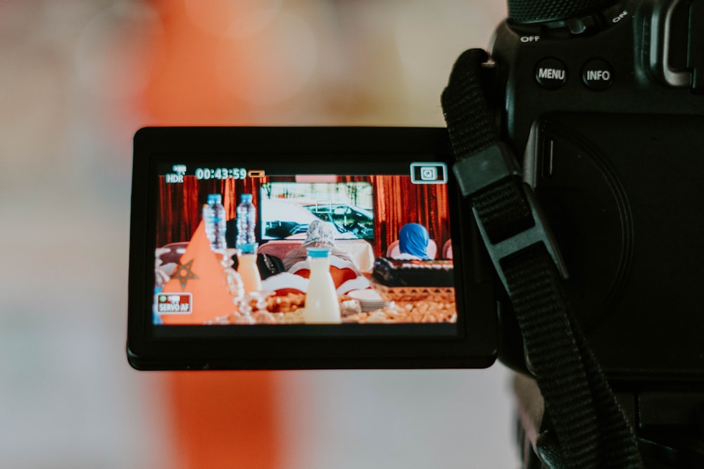 a person holding a camera up to take a picture