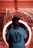 a man standing in front of a circular object