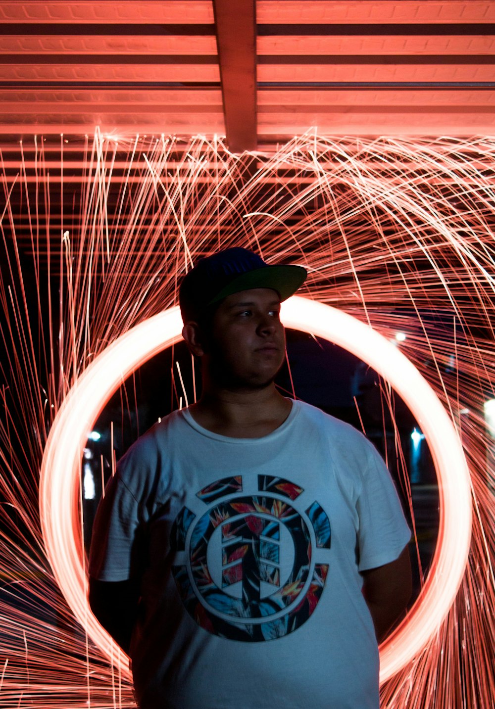 a man standing in front of a circular object