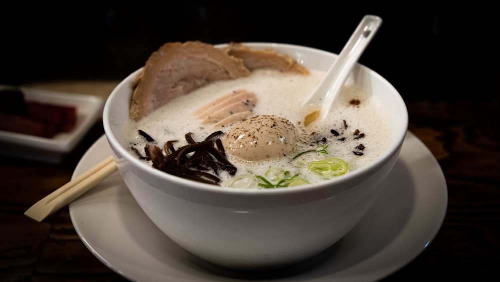 a bowl of soup with a spoon in it