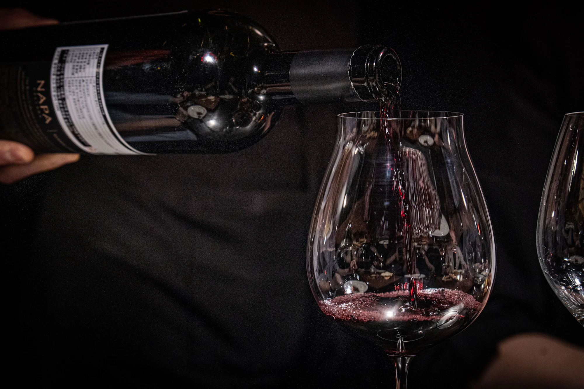 Red wine being poured into a glass