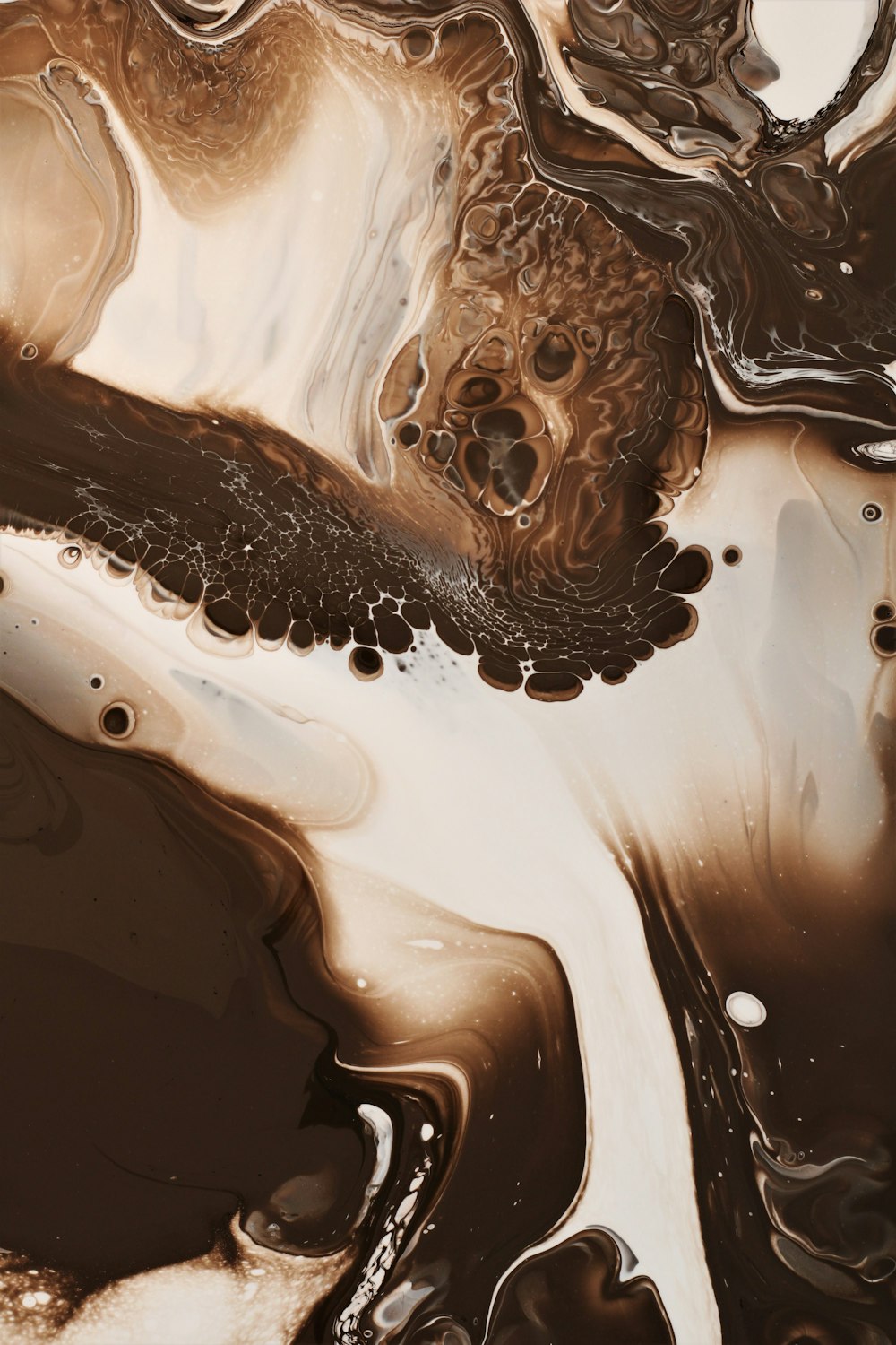 a close up of a brown and white liquid