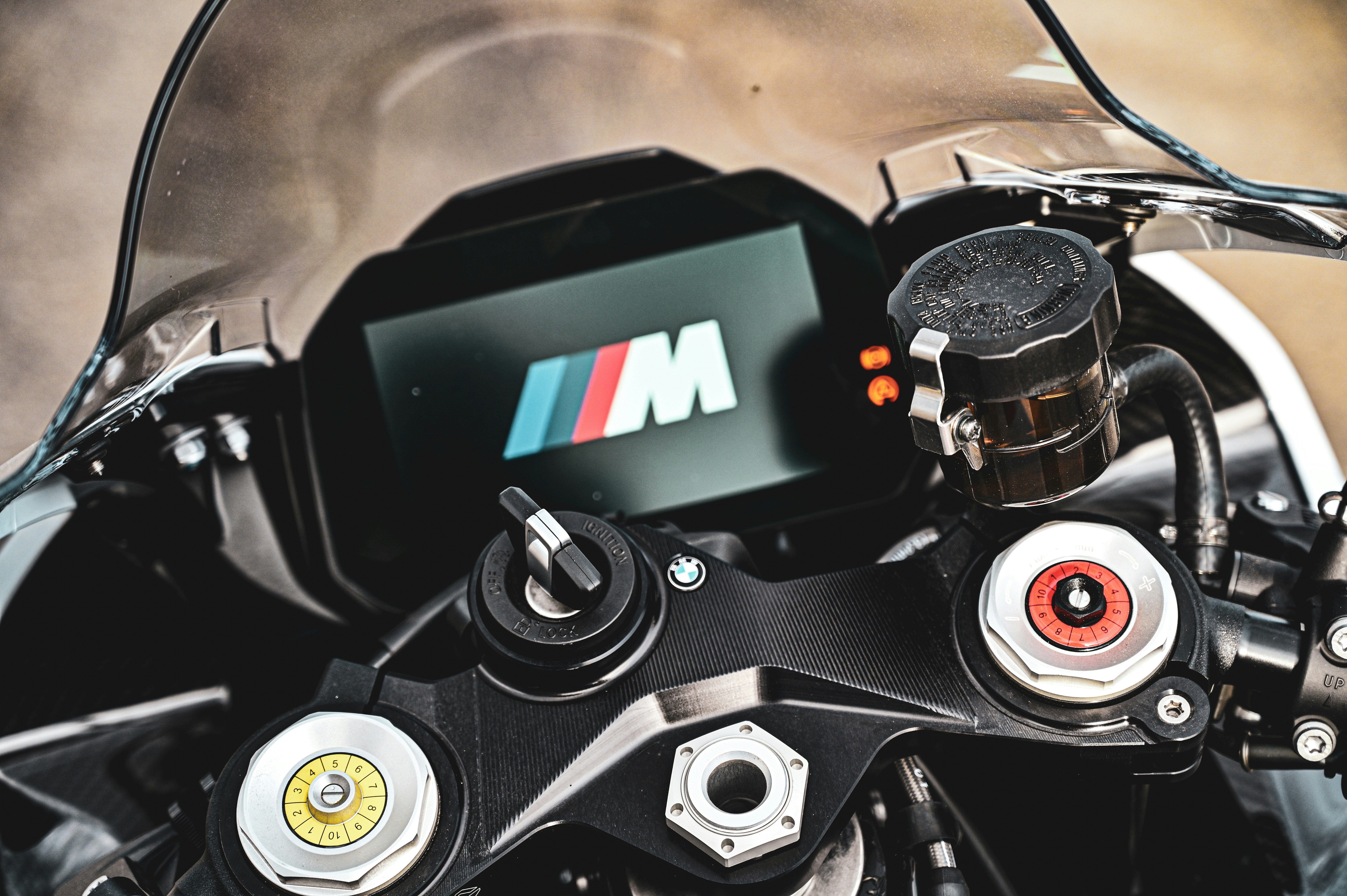 a close up of a motorcycle engine with the m logo on it