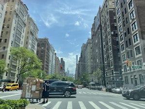 A close-up of a delivery box with a city skyline in the background.