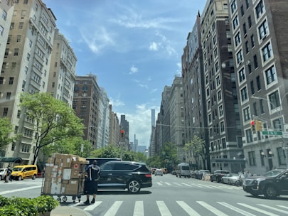 A close-up of a delivery box with a city skyline in the background.