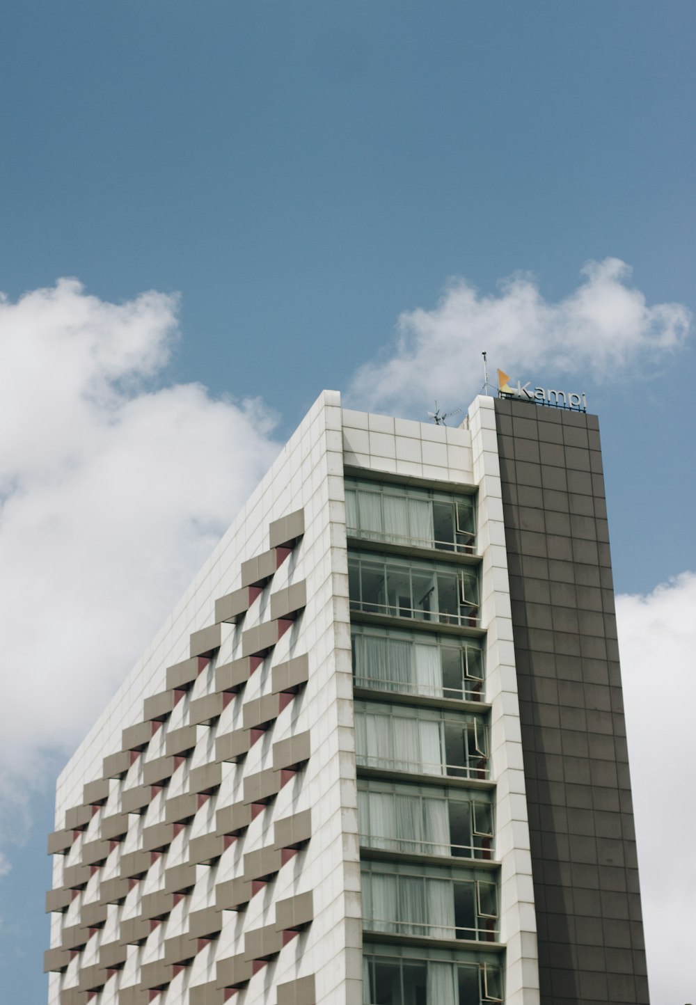 a tall building with a sky background