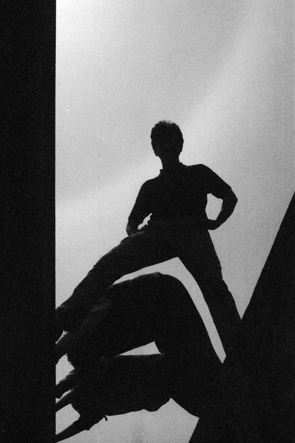 a black and white photo of a person on a skateboard