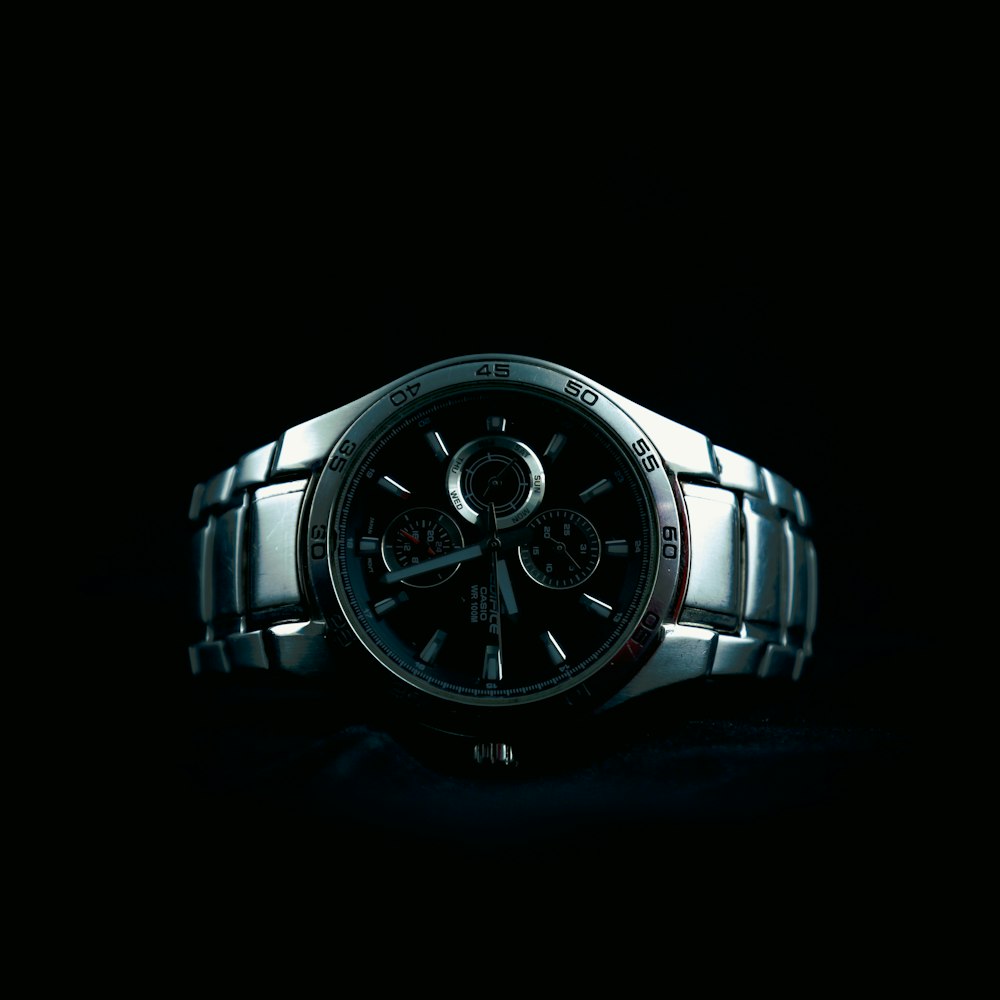 a close up of a watch in the dark