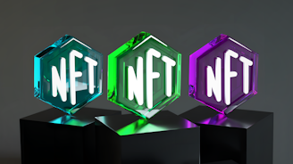 three glass blocks with different letters on them