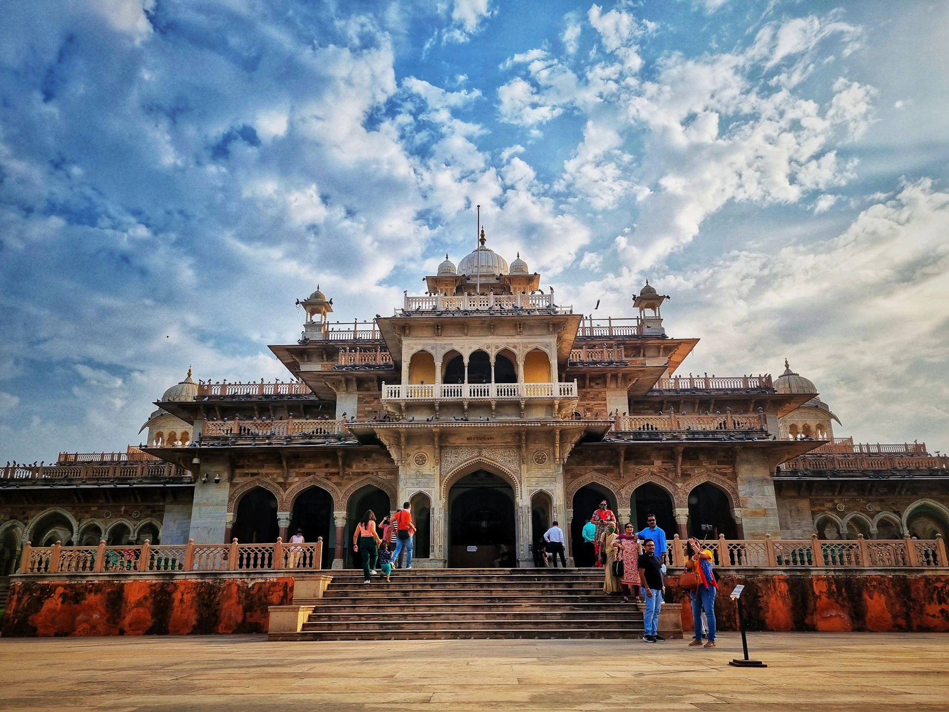 a group of people standing in front of a building