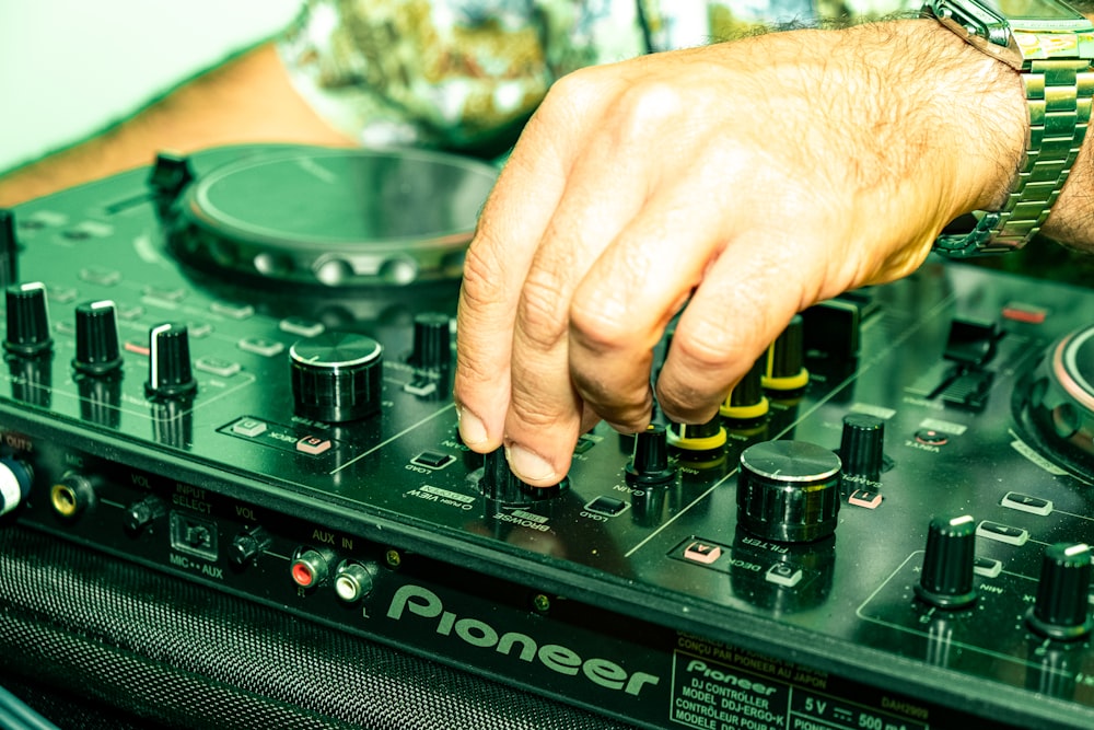 a man is playing music on a dj's turntable