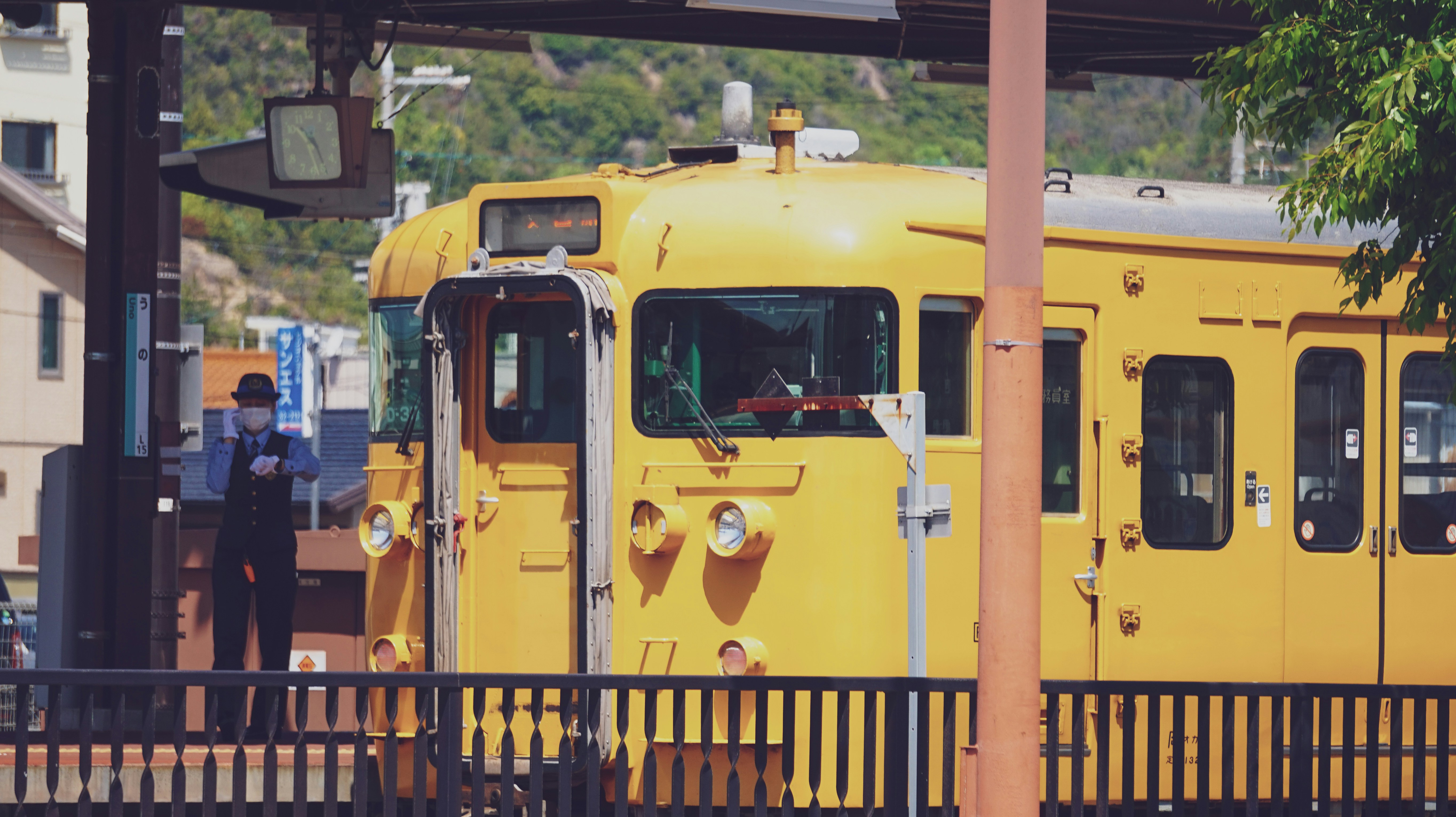 a yellow train parked at a train station