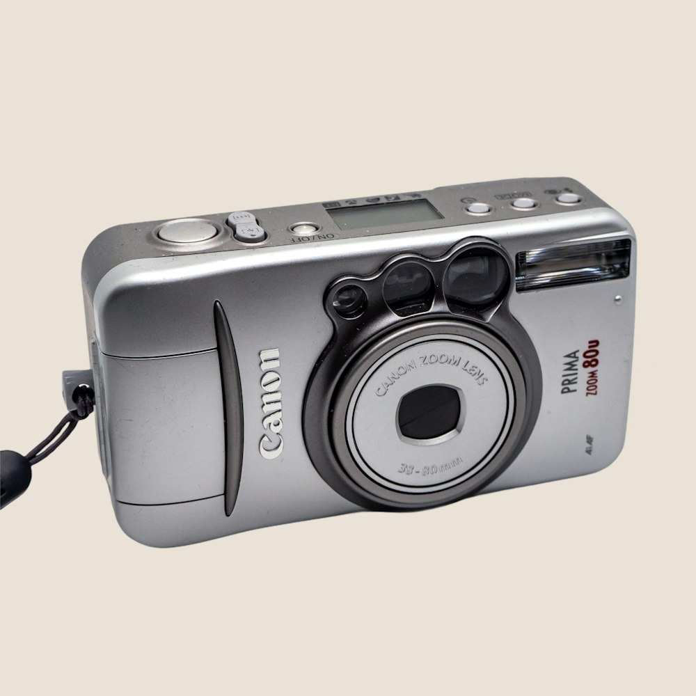 a digital camera with a cord attached to it