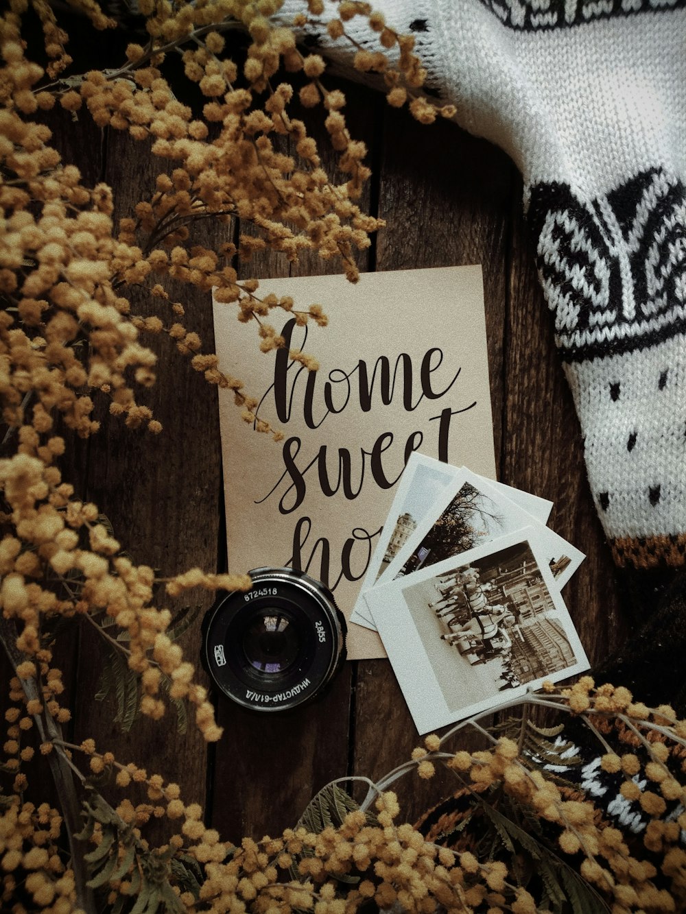 a couple of pictures sitting on top of a wooden table