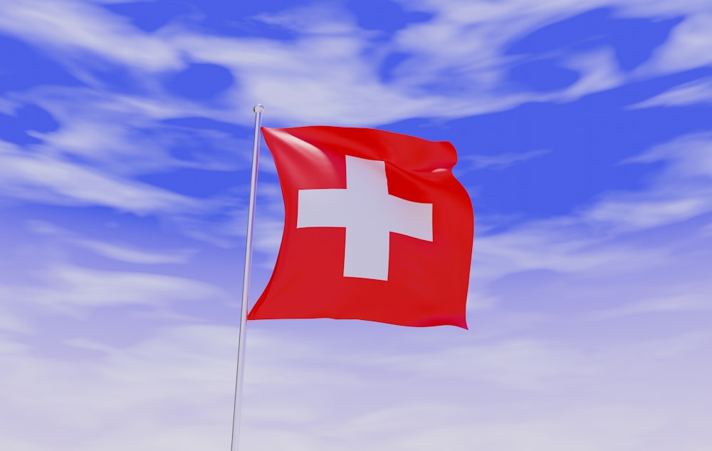 a swiss flag flying high in the sky