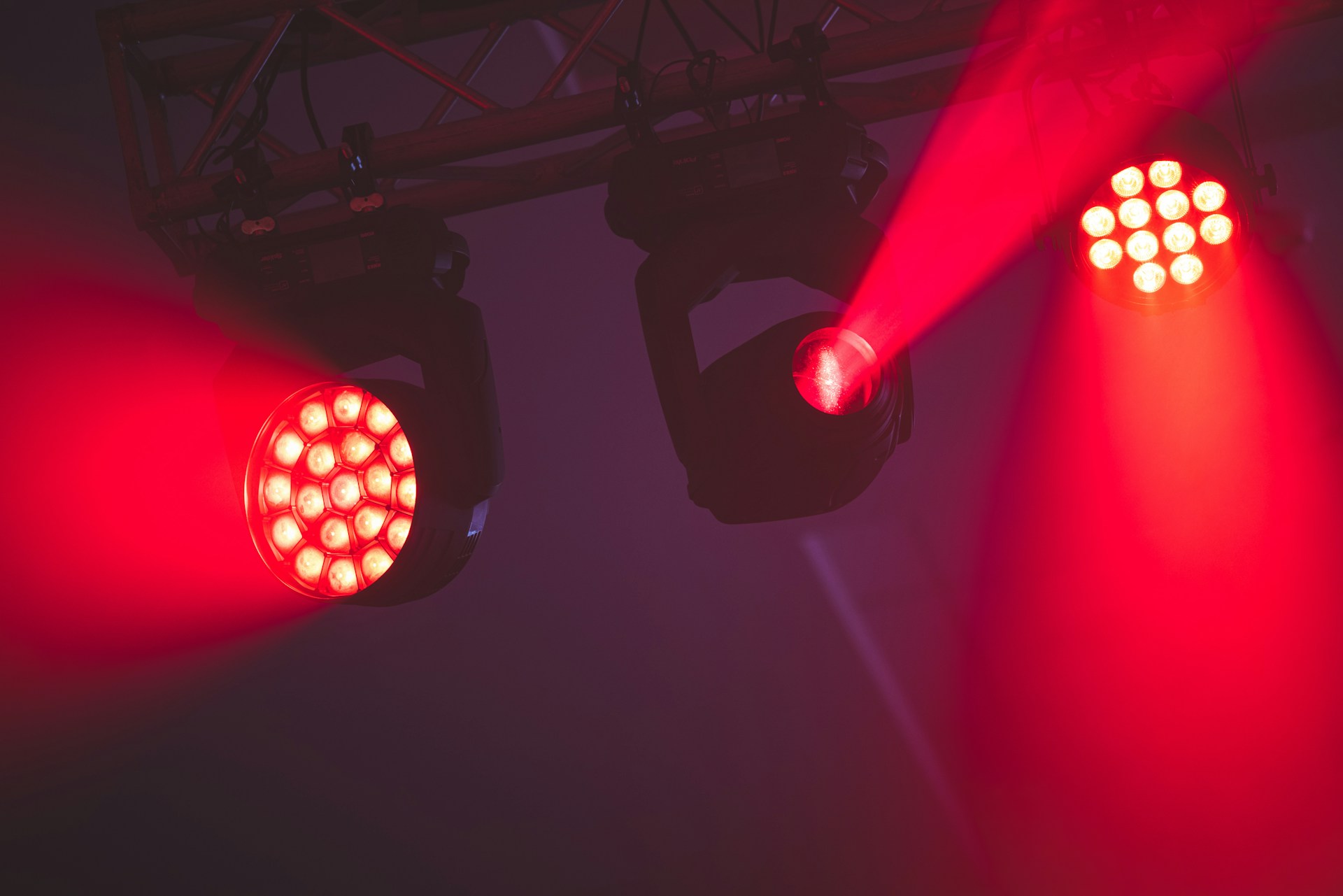 a couple of red lights that are on a wall